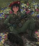  1girl absurdres assault_rifle beret black_boots black_hair boots closed_mouth flower gloves grass green_gloves green_pants gun hat highres holding holding_weapon kuba_world looking_at_viewer lying m16 m16a2 military_uniform original pants red_eyes rifle short_hair solo weapon weapon_request 