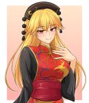  1girl black_dress black_hat blonde_hair blush border breasts brown_background chinese_clothes closed_mouth commentary_request crescent crescent_print crossed_bangs dalachi_(headdress) dress hair_between_eyes hand_up hat hidaruma highres junko_(touhou) large_breasts long_hair long_sleeves looking_at_viewer neck_ribbon outside_border phoenix_print pom_pom_(clothes) red_eyes red_sash red_tabard ribbon sash simple_background smile solo split_mouth standing tabard touhou upper_body white_border wide_sleeves yellow_ribbon yellow_trim 