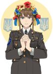  1girl black_necktie blue_eyes brown_hair brown_jacket closed_mouth collared_shirt flower head_wreath highres interlocked_fingers jacket looking_at_viewer medium_hair military military_uniform necktie original own_hands_clasped own_hands_together ribbon_bar russo-ukrainian_war shirt sidelocks solo ukraine ukrainian_flag uniform wani_(perfect_han) white_shirt 