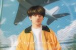  1boy aircraft airplane bangtan_boys black_hair bob_cut brown_hair closed_mouth commentary earrings english_commentary gerimisore jacket jewelry jung_kook looking_at_viewer male_focus outdoors realistic shirt short_hair solo upper_body white_shirt yellow_jacket 