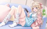 1girl :d absurdres ahoge bandaid bandaid_on_neck blonde_hair blue_bow blue_eyes blue_skirt bow breasts cardigan cat_hair_ornament cellphone cellphone_charm charm_(object) cleavage collared_shirt commentary commission couch cushion ear_piercing earrings fingernails gyaru hair_bow hair_ornament hairclip highres holding holding_phone indie_virtual_youtuber indoors jewelry large_breasts long_fingernails long_hair long_sleeves looking_at_viewer lying mole mole_on_breast mole_on_neck nail_polish necklace no_shoes on_back on_couch open_cardigan open_clothes open_mouth otohana_yuuri phone piercing pink_bow pink_cardigan pink_nails pleated_skirt rama_(yu-light8) ring school_uniform shirt skeb_commission skindentation skirt smartphone smile socks solo thigh_strap v virtual_youtuber white_shirt white_socks x_hair_ornament 