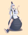  1girl absurdres averageairhead ball bike_shorts_under_skirt black_shorts dress exercise_ball hat highres long_hair mononobe_no_futo one_eye_closed raised_eyebrow short_sleeves shorts sitting smile solo touhou white_dress white_hair yellow_background 