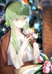  1girl absurdres ahoge blurry bokeh brick budgiepon c.c. code_geass condensation cosplay_request depth_of_field drinking drinking_straw flower food_request green_hair hair_between_eyes hat highres hololive jacket jacket_on_shoulders long_hair raised_eyebrow rose shirt solo very_long_hair white_shirt wide_sleeves yellow_eyes 