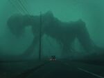  absurdres fog giant giant_monster ground_vehicle highres horror_(theme) kakesoba monster motor_vehicle no_humans original power_lines road van wide_shot 