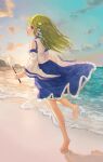  1girl bare_shoulders barefoot beach blue_skirt blush detached_sleeves frog_hair_ornament gohei green_eyes green_hair hair_ornament highres holding ichita_(yixisama-shihaohaizhi) japanese_clothes kochiya_sanae long_hair nontraditional_miko ocean open_mouth skirt smile snake_hair_ornament soles solo toes touhou white_sleeves wide_sleeves 