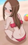  1girl absurdres ball bangs bare_arms bare_shoulders beach beachball bikini blush brown_eyes brown_hair commentary day forehead from_behind highres karakai_jouzu_no_takagi-san long_hair looking_at_viewer looking_back nose_blush note2000 outdoors parted_bangs red_bikini sand side-tie_bikini_bottom solo squatting swimsuit takagi-san water 