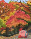  autumn autumn_leaves backpack bag cellphone highres holding holding_phone kirby kirby_(series) miclot no_humans open_mouth outdoors phone railing road smartphone street tree 