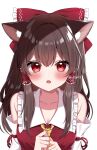  1girl animal_ear_fluff animal_ears ascot blush bow breasts brown_hair cat_ears cleavage commentary_request detached_sleeves frilled_bow frilled_hair_tubes frills hair_bow hair_tubes hakurei_reimu heart heart_in_eye highres long_hair looking_at_viewer open_mouth red_bow red_eyes shinonome_asu solo symbol_in_eye touhou twitter_username yellow_ascot 
