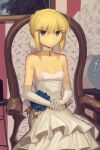  1girl ahoge armchair artoria_pendragon_(fate) bare_shoulders blonde_hair boa_(brianoa) breasts chair choker commentary dress dress_flower elbow_gloves english_commentary fate/stay_night fate_(series) gloves green_eyes hair_bun hands_on_lap highres indoors light_smile looking_at_viewer own_hands_together picture_(object) ribbon_choker saber short_hair sidelocks single_hair_bun sitting small_breasts solo twitter_username updo white_choker white_dress white_gloves 