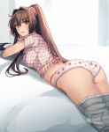  1girl ass blush breasts brown_eyes brown_hair clothes_pull flower grey_pants hair_between_eyes hair_flower hair_ornament highres kantai_collection kasumi_(skchkko) large_breasts long_hair lying on_stomach open_mouth panties pants pants_pull pink_flower ponytail short_sleeves solo underwear white_panties yamato_(kancolle) 