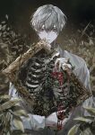  1boy apple closed_mouth exposed_bone floral_background food fruit grey_eyes grey_hair hair_between_eyes highres holding holding_picture_frame looking_at_viewer male_focus mole mole_under_eye original picture_frame shirt short_hair skeleton solo taiyakitarou white_shirt 