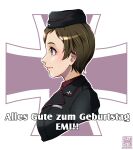  1girl artist_logo black_hat black_jacket brown_eyes brown_hair character_name closed_mouth commentary cropped_torso dated emblem from_side garrison_cap german_text girls_und_panzer hat insignia jacket kojima_emi kuromorimine_(emblem) kuromorimine_military_uniform logo military_hat military_uniform nishi_itsumi short_hair smile solo translated upper_body very_short_hair 