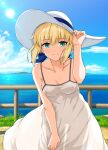  1girl absurdres adjusting_clothes adjusting_headwear artoria_pendragon_(fate) blonde_hair blue_sky breasts collarbone commentary covered_nipples day dress fate/stay_night fate_(series) grass green_eyes haruhisky hat highres looking_at_viewer medium_breasts mountainous_horizon ocean railing saber_(fate) sky sleeveless sleeveless_dress solo spaghetti_strap standing sun sun_hat white_dress white_hat 