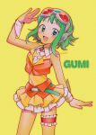  1girl absurdres behind-the-head_headphones belt blush breasts brooch character_name cleavage commentary_request cowboy_shot detached_collar frilled_thigh_strap goggles goggles_on_head green_eyes green_hair gumi hand_up headphones headset highres jewelry looking_to_the_side menma_(enaic31) miniskirt open_mouth red-tinted_eyewear short_hair skirt smile solo thigh_strap tinted_eyewear vest vocaloid wrist_cuffs yellow_background 
