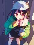  1girl adapted_costume bandaid bandaid_on_shoulder baseball_cap black_hair black_shirt cellphone collarbone commentary contemporary ear_piercing green_jacket hair_between_eyes hat highres holding holding_phone horned_hat index_finger_raised jacket long_hair looking_at_viewer nippaku_zanmu phone piercing print_shirt red_eyes shirt smartphone solo spiked_ear_piercing thigh_strap touhou zhangyuan0304 