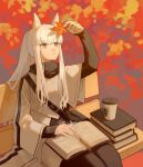  1girl animal_ear_fluff animal_ears arknights arm_up autumn_leaves bench black_pantyhose black_shirt book brown_eyes closed_mouth coffee_cup commentary_request cup disposable_cup feet_out_of_frame highres holding holding_leaf jacket leaf looking_away maple_leaf miike_(992058) on_bench open_book pantyhose park_bench platinum_(arknights) shirt sitting solo white_hair white_jacket 
