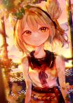  1girl absurdres bare_shoulders blurry bracelet breasts chromatic_aberration depth_of_field earmuffs hair_between_eyes highres itsumizu jewelry leaf light_brown_hair light_particles looking_at_viewer medium_breasts medium_hair neck_ribbon orange_eyes pointy_hair ribbon sidelighting sleeveless smile solo touhou toyosatomimi_no_miko upper_body 