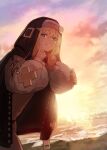  1boy absurdres beach blonde_hair blue_eyes bridget_(guilty_gear) cloud eyebrows_visible_through_hat finger_to_face guilty_gear guilty_gear_strive hair_between_eyes highres long_hair looking_at_viewer male_focus mars_symbol navel nun otoko_no_ko putama sand sky smile solo sunset water 