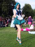  bishoujo_senshi_sailor_moon cosplay dress highres legs miniskirt photo real sailor_neptune sailor_neptune_(cosplay) short_dress skirt smile solo thighs 