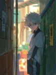  1boy alley blue_eyes blurry blurry_background commentary commentary_request day hand_in_pocket hunter_x_hunter killua_zoldyck looking_at_viewer male_child male_focus messy_hair outdoors shirt short_hair shorts solo white_hair zukki_(suzukio) 