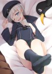  1girl bed black_legwear blue_dress blue_eyes blue_hat clothes_writing dress failure_penguin foreshortening hand_on_own_chest hat kantai_collection looking_at_viewer lying mofu_namako one_eye_closed open_mouth pov sailor_dress sailor_hat short_hair silver_hair smile socks solo stuffed_animal stuffed_penguin stuffed_toy upper_teeth z1_leberecht_maass_(kantai_collection) 