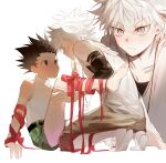  2boys bare_legs bare_shoulders barefoot black_hair commentary commentary_request face-to-face gon_freecss green_shorts hands_on_another&#039;s_leg highres hunter_x_hunter killua_zoldyck leg_grab looking_at_another male_child male_focus multiple_boys red_ribbon ribbon shirt short_hair shorts simple_background sitting spiked_hair white_background white_hair white_shirt yaoi yomi4310 