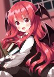  1girl bat_wings blurry blurry_background blush book book_stack breasts cowboy_shot depth_of_field dutch_angle head_wings highres holding holding_book indoors koakuma long_hair long_sleeves looking_at_viewer medium_breasts open_book open_mouth petticoat red_hair ruu_(tksymkw) shirt solo touhou window wings 