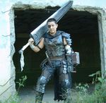  armor berserk cosplay guts male male_focus photo sword weapon 