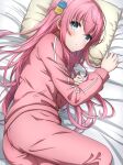  1girl absurdres blue_eyes blush bocchi_the_rock! commentary cube_hair_ornament feet_out_of_frame gotoh_hitori hair_ornament highres jacket long_hair looking_at_viewer lying noshimurin on_bed on_side one_side_up pants pillow pink_hair pink_jacket pink_pants solo track_jacket track_suit 