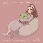  1girl absurdres blush brown_hair character_doll crossover doll_hug forehead full_body fur_dress fur_hairband highres idolmaster idolmaster_cinderella_girls larvitar long_hair looking_afar object_hug pokemon rakkopower red_eyes seki_hiromi simple_background sitting slippers wavy_hair 