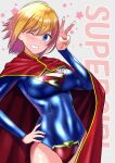  1girl ahoge bangs blonde_hair blue_eyes blush breasts cape cowboy_shot dc_comics english_text hand_on_hip highres looking_at_viewer navel one_eye_closed red_cape short_hair smile solo star_(symbol) supergirl superman_(series) teeth v wakana_hanabi 