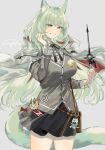  1girl animal_ear_fluff animal_ears arknights bag_charm bow bowtie cape cardigan cat_ears cat_girl cat_tail character_name charm_(object) collared_shirt cowboy_shot green_eyes green_hair grey_cardigan gu_(gu_da_yo) hand_in_own_hair hand_up harmonie_(arknights) highres holding holding_wand long_hair miniskirt pleated_skirt shirt simple_background skirt smile standing tail wand white_cape 