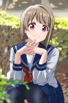  1girl arms_on_knees bangs black_thighhighs blue_sailor_collar blue_skirt blurry blurry_background blurry_foreground bush commentary day dot_nose highres interlocked_fingers kousuke0912 light_blush light_brown_hair long_sleeves looking_at_viewer love_live! love_live!_nijigasaki_high_school_idol_club nakasu_kasumi neckerchief outdoors pink_eyes plant red_neckerchief sailor_collar school_uniform serafuku shirt short_hair skirt smile solo squatting thighhighs thighs white_shirt 