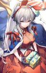  1girl animal_ears arknights bangs blue_cape blue_gloves blurry blurry_background breasts cape christmas closed_mouth commentary deer_ears dress fake_animal_ears fur-trimmed_cape fur_trim gift gloves grey_hair hair_between_eyes half_gloves herigaru_(fvgyvr000) highres holding holding_gift large_breasts light_blush long_hair looking_afar ponytail red_dress red_eyes red_ribbon ribbon solo upper_body weedy_(arknights) 