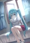  1girl absurdres bangs bed bedroom blue_eyes blue_hair dutch_angle grey_shirt hair_between_eyes hatsune_miku highres ille_(xcpa7325) indoors long_hair long_sleeves looking_at_viewer miniskirt object_hug pillow pillow_hug pleated_skirt red_skirt shiny shiny_hair shirt sitting skirt slippers solo twintails very_long_hair vocaloid 