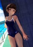  1girl absurdres against_wall aioe arm_behind_back bangs blue_one-piece_swimsuit blunt_bangs blurry blurry_background blush breasts brown_hair cameltoe closed_mouth collarbone commentary competition_school_swimsuit covered_navel cowboy_shot dutch_angle head_tilt highres looking_at_viewer medium_breasts original outdoors pool ringed_eyes school_swimsuit shade short_hair smile solo spread_fingers standing swimsuit tan variant_set wet wet_hair 
