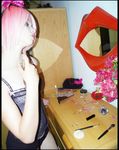  1girl cosplay haruno_sakura head_tilt mirror naruto photo pink_hair short_hair smile solo 