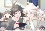  2boys absurdres ahoge alternate_costume bangs bed black_pants brown_eyes brown_hair character_doll collarbone danganronpa_(series) danganronpa_2:_goodbye_despair grey_hair grin handheld_game_console hands_up highres hinata_hajime holding holding_handheld_game_console indoors komaeda_nagito long_sleeves lying male_focus messy_hair midou_(grk12138) multiple_boys nintendo_switch on_bed on_stomach pants parted_lips pillow shiny shiny_hair short_hair smile teeth 