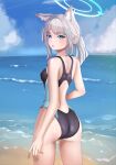  1girl absurdres animal_ear_fluff animal_ears ass bangs beach black_one-piece_swimsuit blue_archive blue_eyes blue_sky breasts cloud commentary competition_swimsuit cross_hair_ornament day extra_ears fosqie from_below grey_hair hair_ornament halo highres horizon looking_at_viewer low_ponytail medium_breasts medium_hair mismatched_pupils mixed-language_commentary multicolored_clothes multicolored_swimsuit ocean official_alternate_costume one-piece_swimsuit outdoors shiroko_(blue_archive) shiroko_(swimsuit)_(blue_archive) sky solo swimsuit 