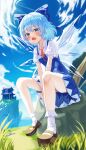  1girl absurdres blue_bow blue_dress blue_eyes blue_hair blue_sky blush bow brown_footwear cirno cloud commentary day dress fang grass hair_between_eyes hair_bow highres ice ice_wings ju-ok legs looking_at_viewer open_mouth outdoors shoes short_hair sitting skin_fang sky socks solo touhou white_socks wings 