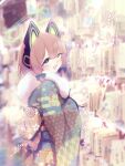  1girl absurdres animal_ear_headphones animal_ears blonde_hair blue_archive blurry blurry_background cat_ear_headphones cat_tail commentary_request egasumi ema fake_animal_ears fake_tail flower fur-trimmed_kimono fur_trim green_eyes hair_flower hair_ornament halo headphones highres japanese_clothes kanzashi kimono midori_(blue_archive) new_year obi open_mouth sash shi0n_krbn shrine smile solo tail translation_request 