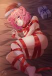  1girl absurdres artist_name ass bob_cut box breasts christmas christmas_present commentary doki_doki_literature_club from_above fur-trimmed_headwear gift gift_box hair_ornament hair_ribbon hat hat_removed headwear_removed highres holding holding_ribbon imucy legs light_particles looking_at_viewer looking_up lying naked_ribbon natsuki_(doki_doki_literature_club) no_shoes on_bed on_side parted_lips pink_eyes pink_hair pom_pom_(clothes) red_headwear red_ribbon ribbon santa_hat short_hair signature small_breasts socks solo two_side_up white_socks x_hair_ornament 
