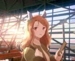  1girl airport animal_ears blurry blurry_background brown_hair cellphone ear_covers green_jacket grey_shirt hands_up highres holding holding_phone horse_ears indoors jacket king_halo_(umamusume) long_hair looking_at_viewer mimi_(usausamm5) open_mouth phone photo_background red_eyes shirt smile solo umamusume upper_body 