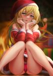  1girl :d absurdres bangs bare_legs blonde_hair blurry blurry_background blush box christmas christmas_tree dark_magician_girl dress floating_hair fur-trimmed_dress fur-trimmed_headwear fur_trim gift gift_box green_eyes hair_between_eyes hat head_tilt highres long_hair looking_at_viewer off-shoulder_dress off_shoulder open_mouth othellonia_teru panties pantyshot red_dress red_headwear red_panties santa_costume santa_hat shiny shiny_skin short_dress sitting smile solo underwear very_long_hair yu-gi-oh! 