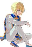  1boy bangs blonde_hair blue_footwear blue_tabard closed_mouth elbow_on_knee hair_between_eyes highres hunter_x_hunter kurapika long_sleeves looking_to_the_side lunar_(lunar_815) pants shirt short_hair simple_background sitting solo tabard white_background white_pants white_shirt 