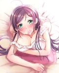  1girl ahoge arihara_(arhr0) bare_shoulders bed blush breasts condom condom_in_mouth green_eyes large_breasts long_hair looking_at_viewer love_live! love_live!_school_idol_project mouth_hold pillow purple_hair ribbon smile solo toujou_nozomi twintails 