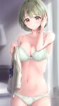  1girl :o absurdres blurry blurry_background blush bra breasts cleavage collarbone fujinomiya_rio green_bra green_eyes green_hair green_panties groin hand_on_own_head highres holding holding_clothes idolmaster idolmaster_shiny_colors indoors looking_at_viewer medium_breasts nanakusa_nichika navel panties short_hair skindentation solo underwear underwear_only vest_removed 