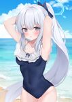  1girl armpits beach black_one-piece_swimsuit blue_archive blue_halo blush breasts collarbone commentary cowboy_shot day frilled_one-piece_swimsuit frills grey_hair halo hands_in_own_hair highres long_hair looking_at_viewer miyako_(blue_archive) miyako_(swimsuit)_(blue_archive) ocean off-shoulder_one-piece_swimsuit off_shoulder official_alternate_costume one-piece_swimsuit outdoors parted_lips ponytail purple_eyes sasakichi_(ssk_chi) small_breasts solo swimsuit 