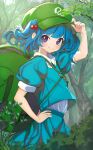  1girl blue_eyes blue_hair blue_shirt blue_skirt closed_mouth day flat_cap forest green_headwear hair_bobbles hair_ornament hand_on_own_hip hat highres kawashiro_nitori key looking_at_viewer medium_hair nature nerutora outdoors puffy_short_sleeves puffy_sleeves shirt short_sleeves skirt smile solo touhou two_side_up 