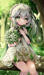  1girl absurdres bare_shoulders blurry blurry_background blush bracelet braid brooch bug butterfly colored_tips cross-shaped_pupils crown_braid crystalfly_(genshin_impact) detached_sleeves dress flower gem genshin_impact gold_trim gradient_hair grass green_eyes green_gemstone green_hair green_sleeves hair_between_eyes hair_ornament hand_on_own_chest highres holding holding_flower in_tree jewelry leaf_hair_ornament light_rays long_hair looking_at_viewer multicolored_hair nahida_(genshin_impact) nichino outdoors parted_lips pointy_ears short_dress short_sleeves side_ponytail sidelocks sitting sitting_in_tree sleeveless sleeveless_dress solo sunbeam sunlight symbol-shaped_pupils thighs tree two-tone_hair white_dress white_flower white_hair 